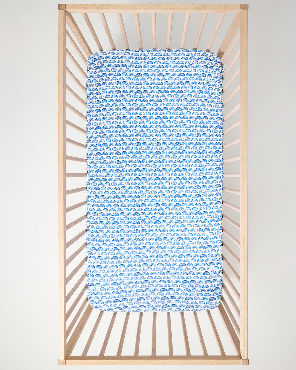 Aerial view of the Blue Rainbows Fitted Crib Sheet