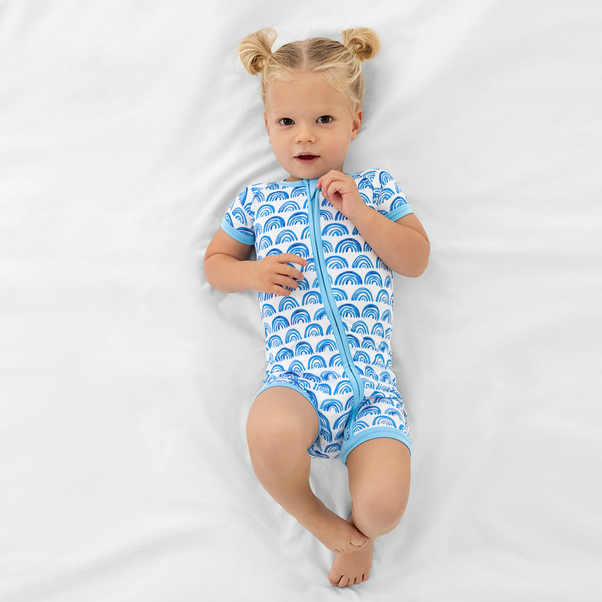 Aerial view of child wearing the Blue Rainbows Shorty Zippy