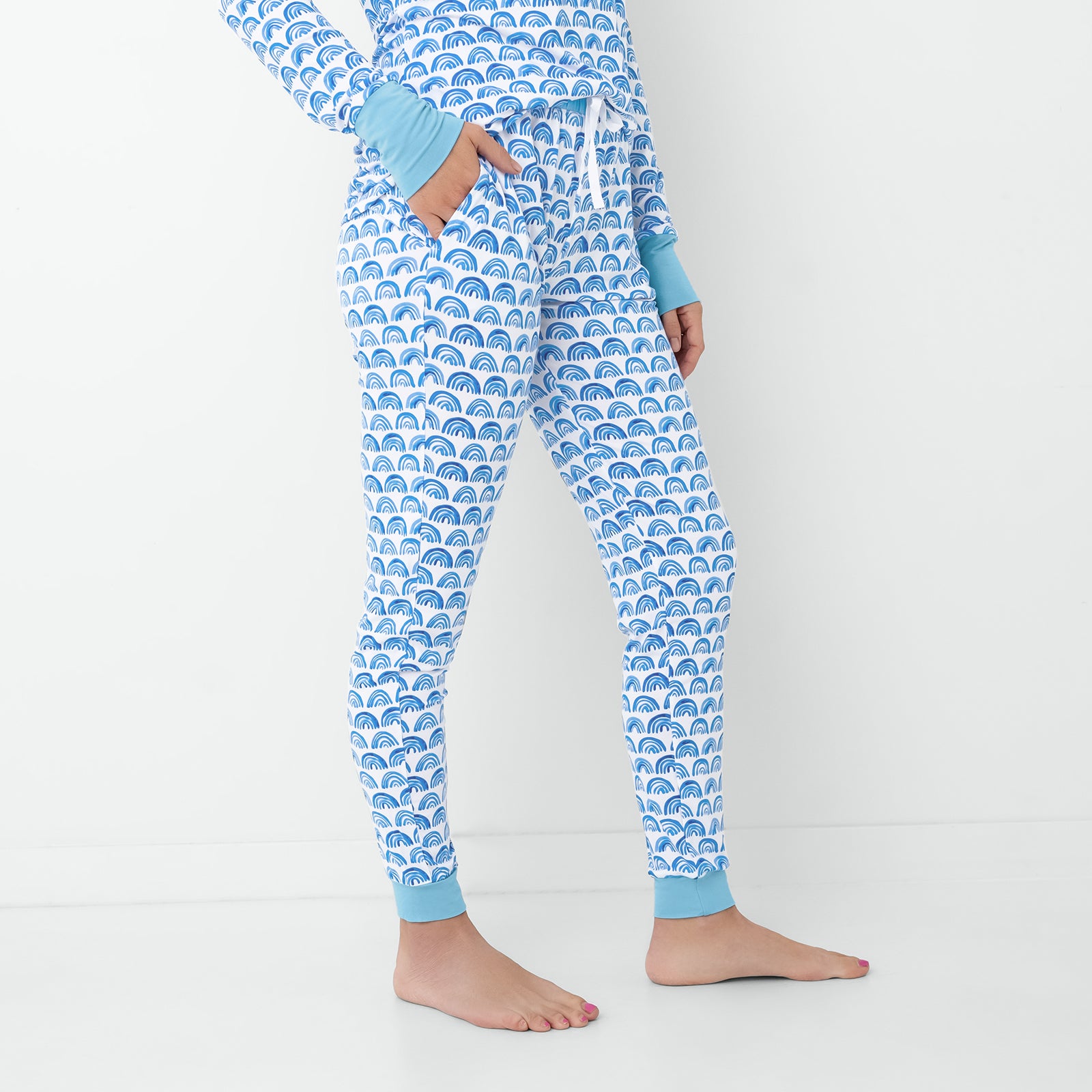 Standing woman wearing the Blue Rainbows Women's Pajama Pants