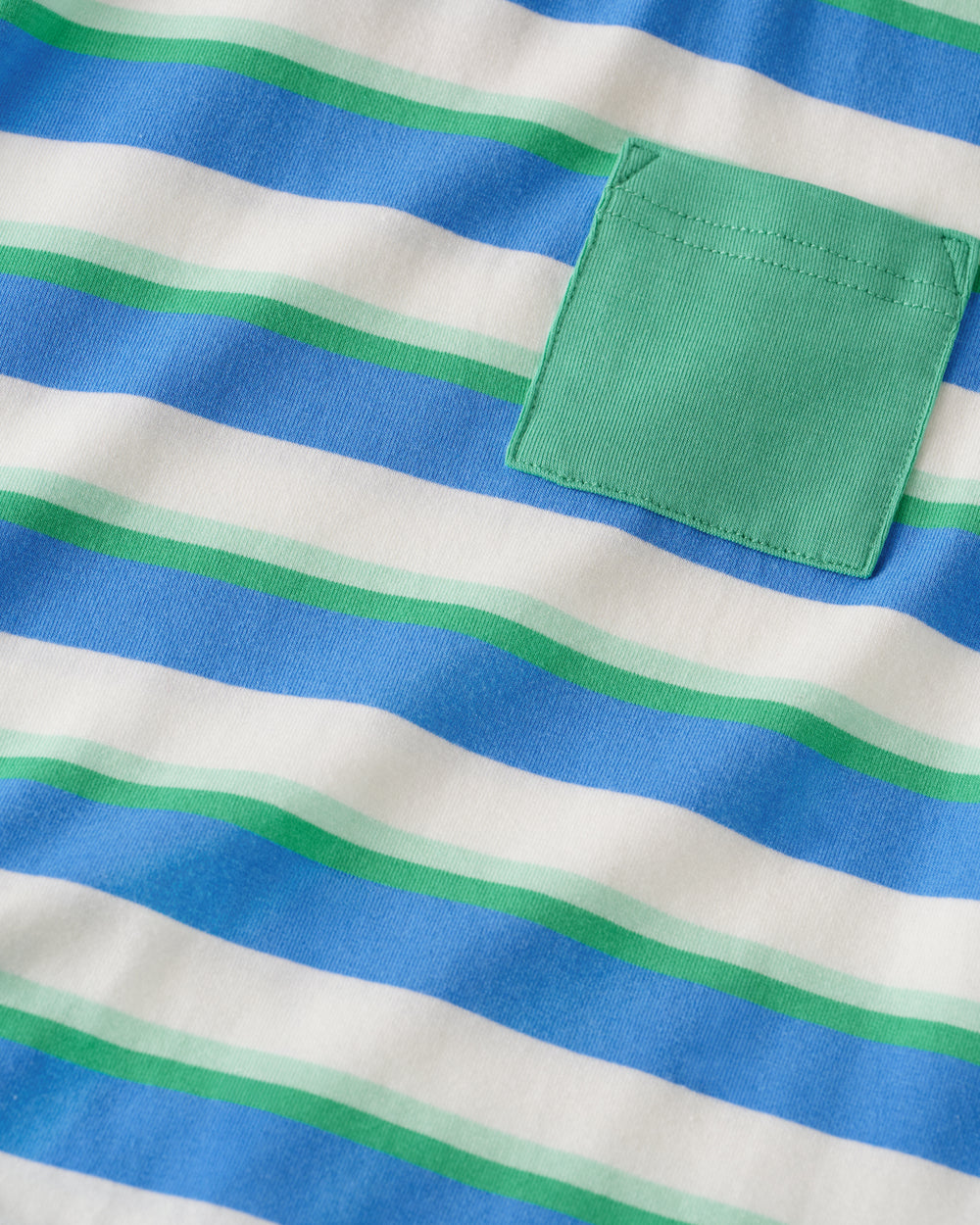 Close up of the pocket detail on the Blue Bolt Stripes Relaxed Pocket Tee