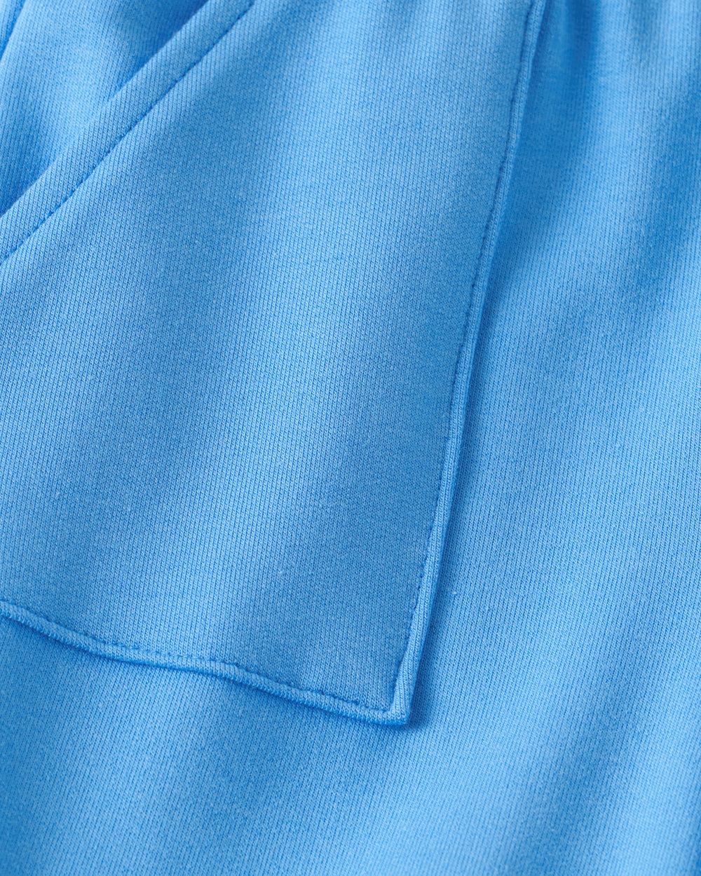 Close up flat lay of the pocket on the Blue Bolt Shorts