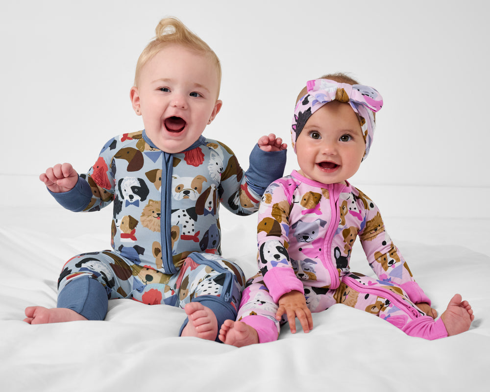 Two babies wearing matching Puppy Parade Zippys
