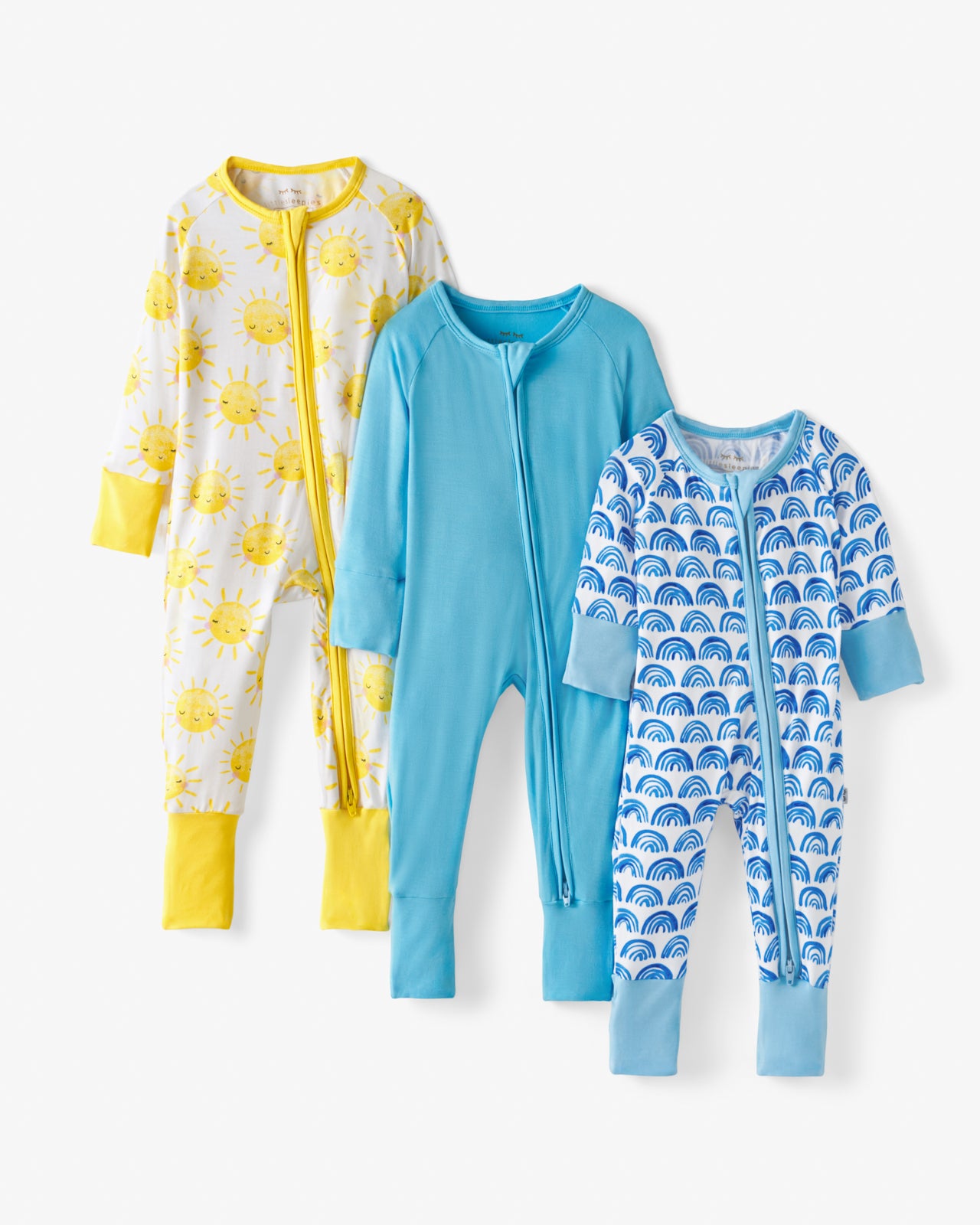 Flat lay of the Blue Rainbows, Sky Blue & Sunshine Zippys in the Grow With Me Three Pack Gift Box