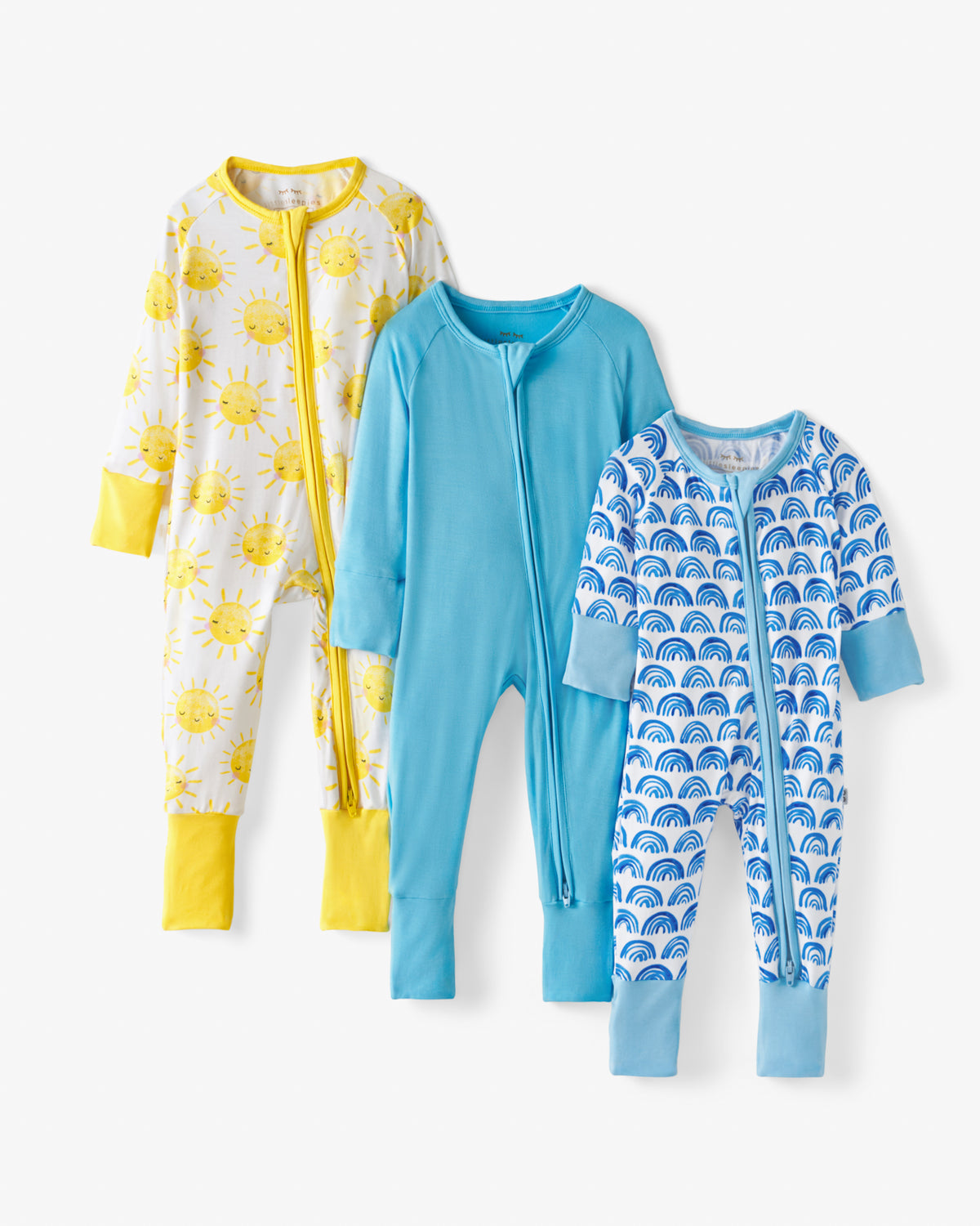 Flat lay of the Blue Rainbows, Sky Blue & Sunshine Zippys in the Grow With Me Three Pack Gift Box