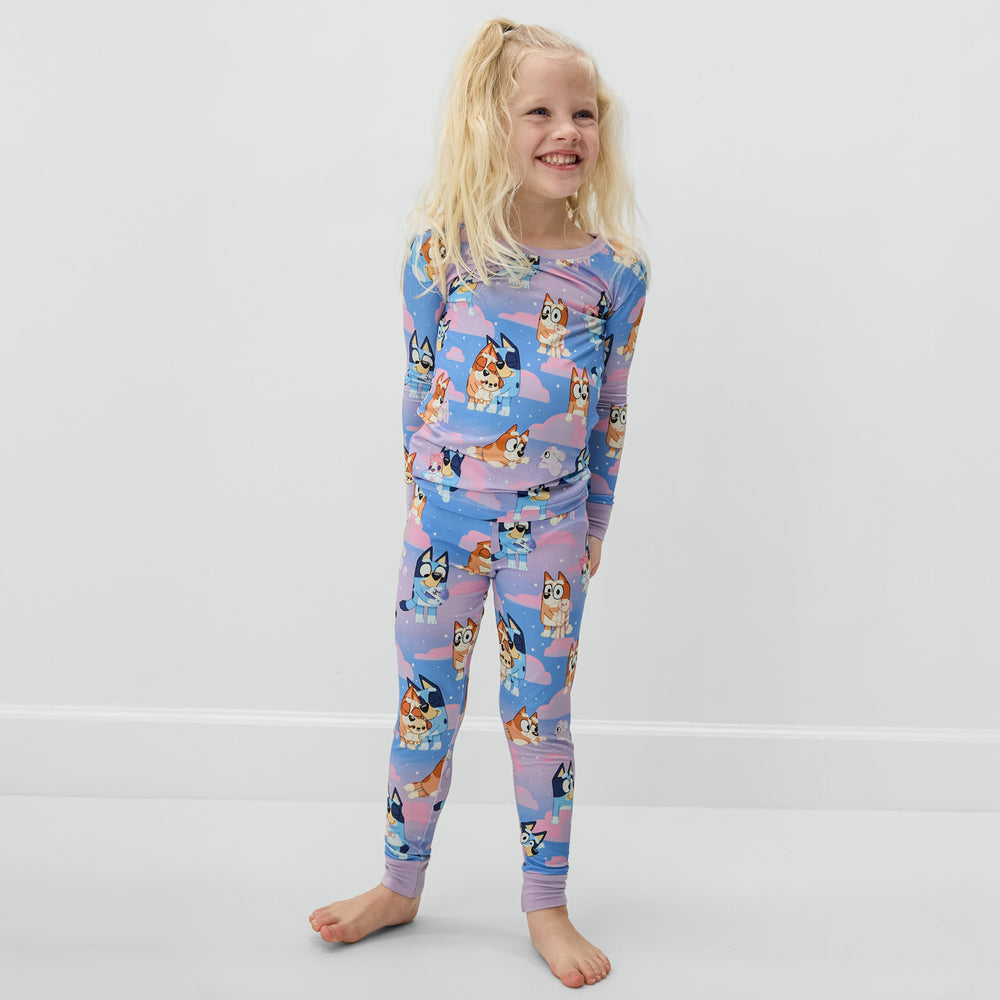Standing child wearing the Bluey Purple Sleepytime Two-Piece Long Sleeve & Pants Pajama Set