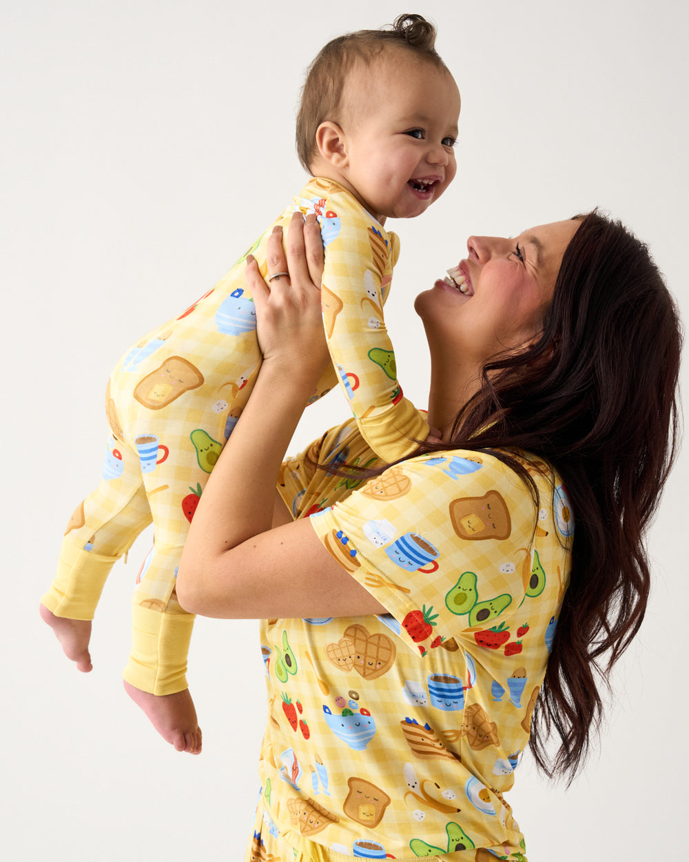 Mother holding child in the air wearing the Breakfast Bunch Women's Short Sleeve Pajama Top