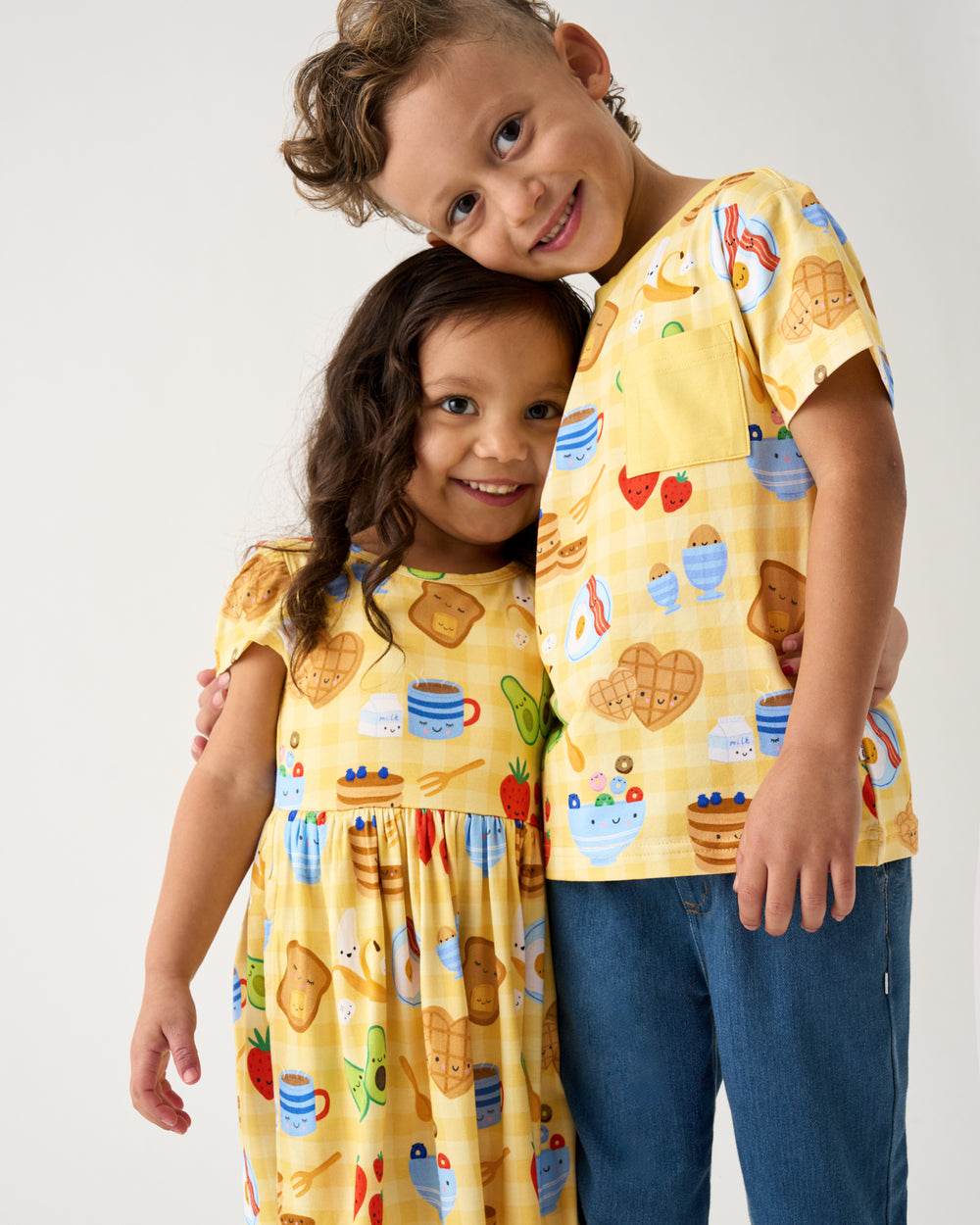 Two children wearing matching Breakfast Bunch play styles