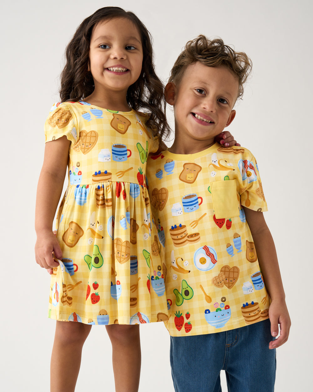 Two kids wearing matching Breakfast Bunch daywear styles