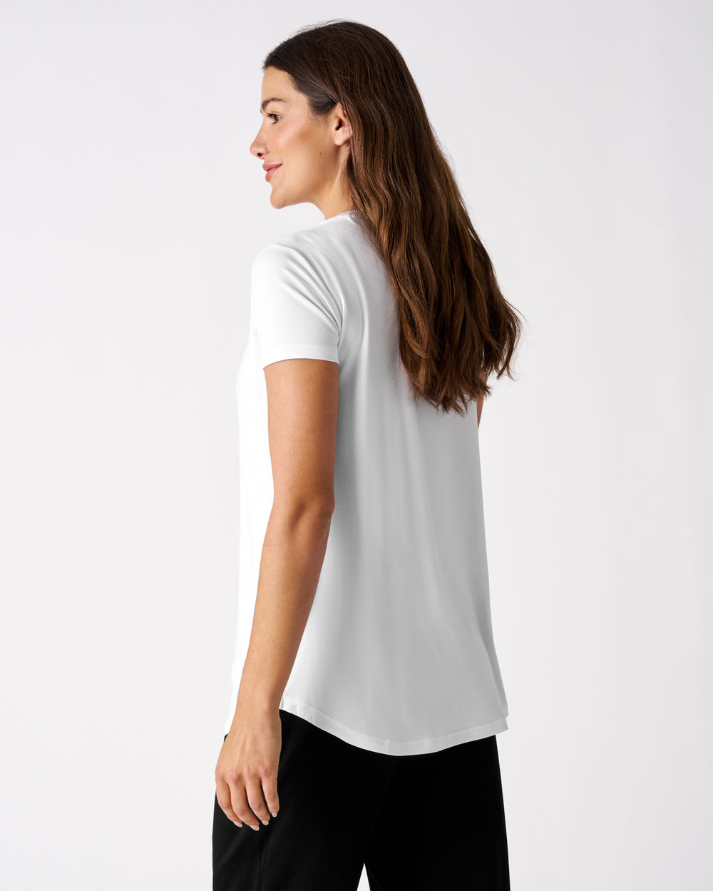 Back view of woman wearing the Bright White Women's Nursing Top