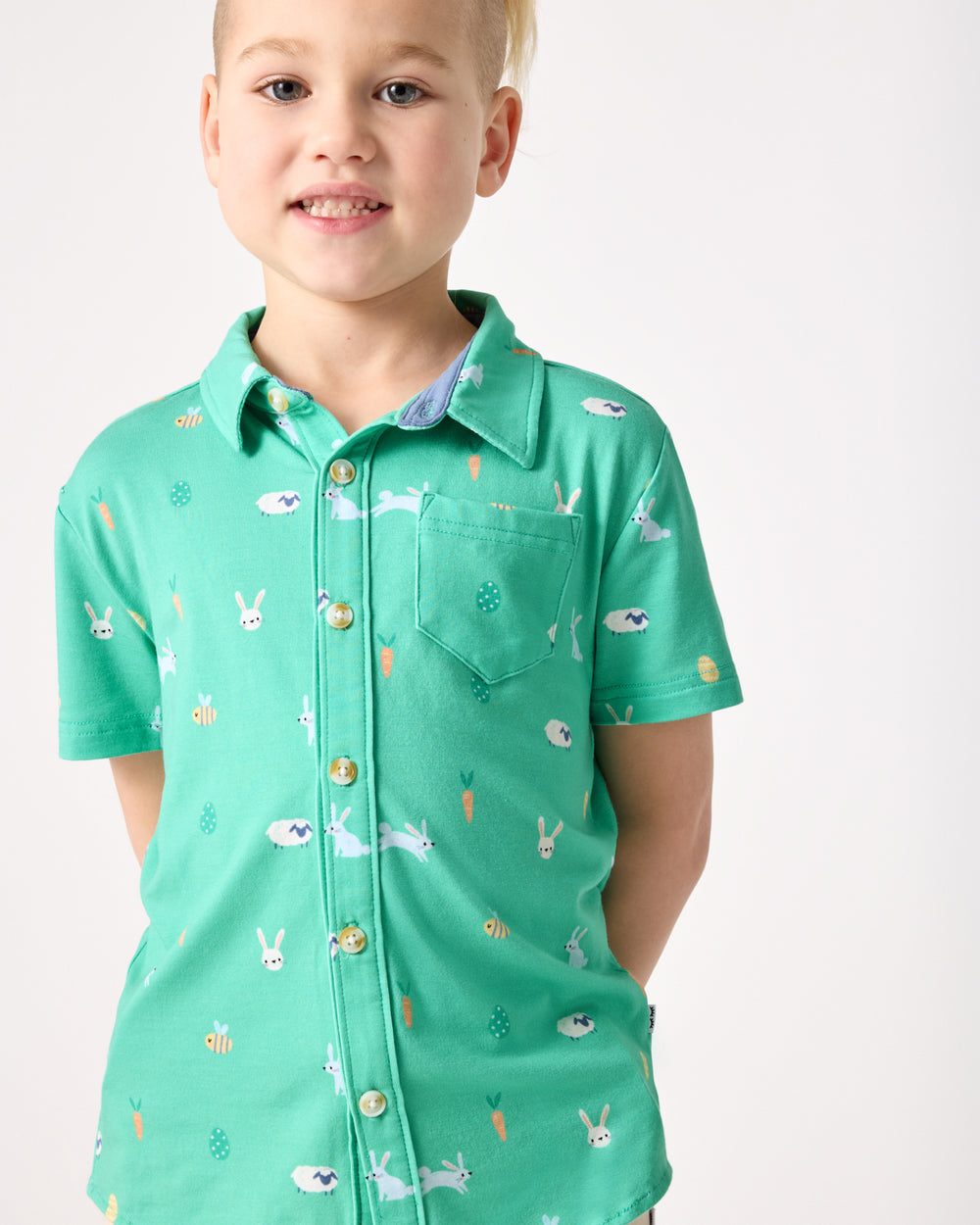 Close up of boy wearing the Bunny Burrow Button Down Polo