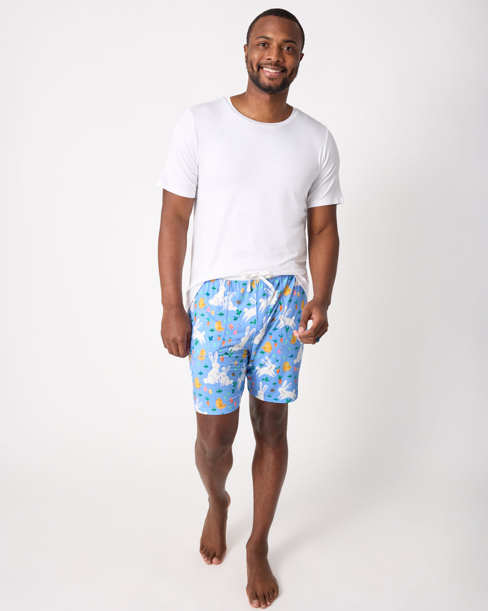 Man wearing the Bunny Patch Men's Pajama Shorts with a white tee