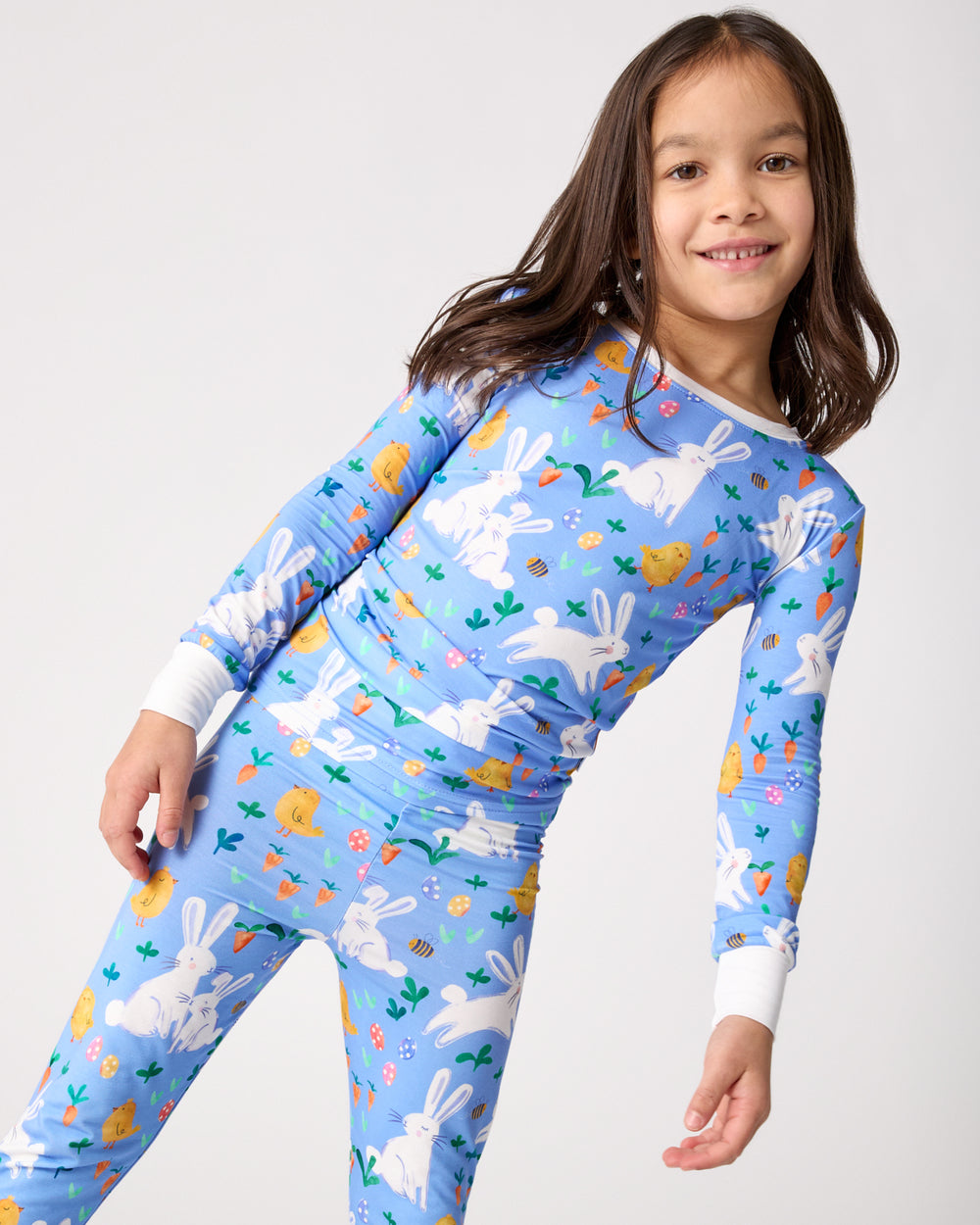 Standing girl wearing the Bunny Patch Two-Piece Pajama Set