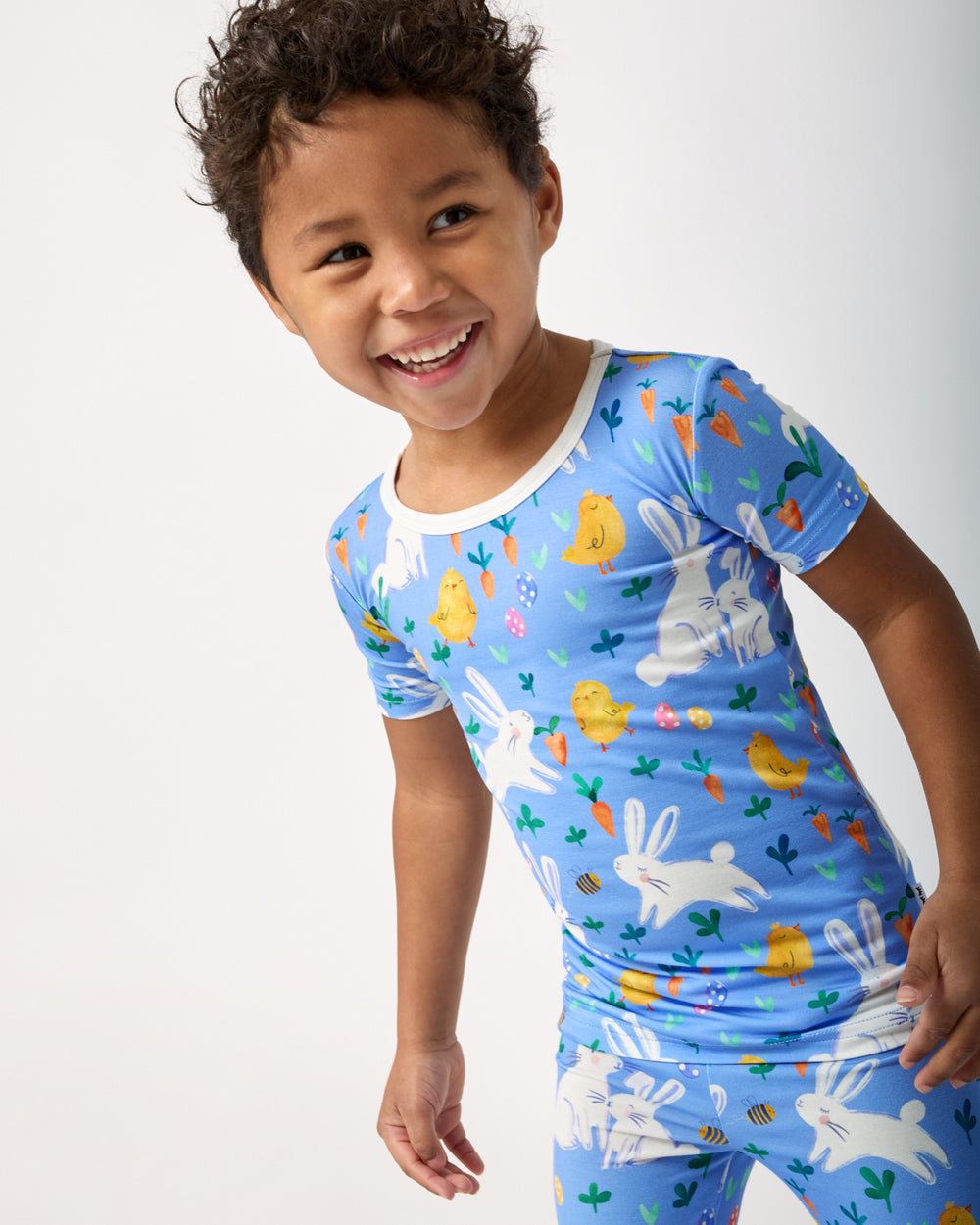 Close up of boy wearing the Bunny Patch Two-Piece Short Sleeve Pajama Set