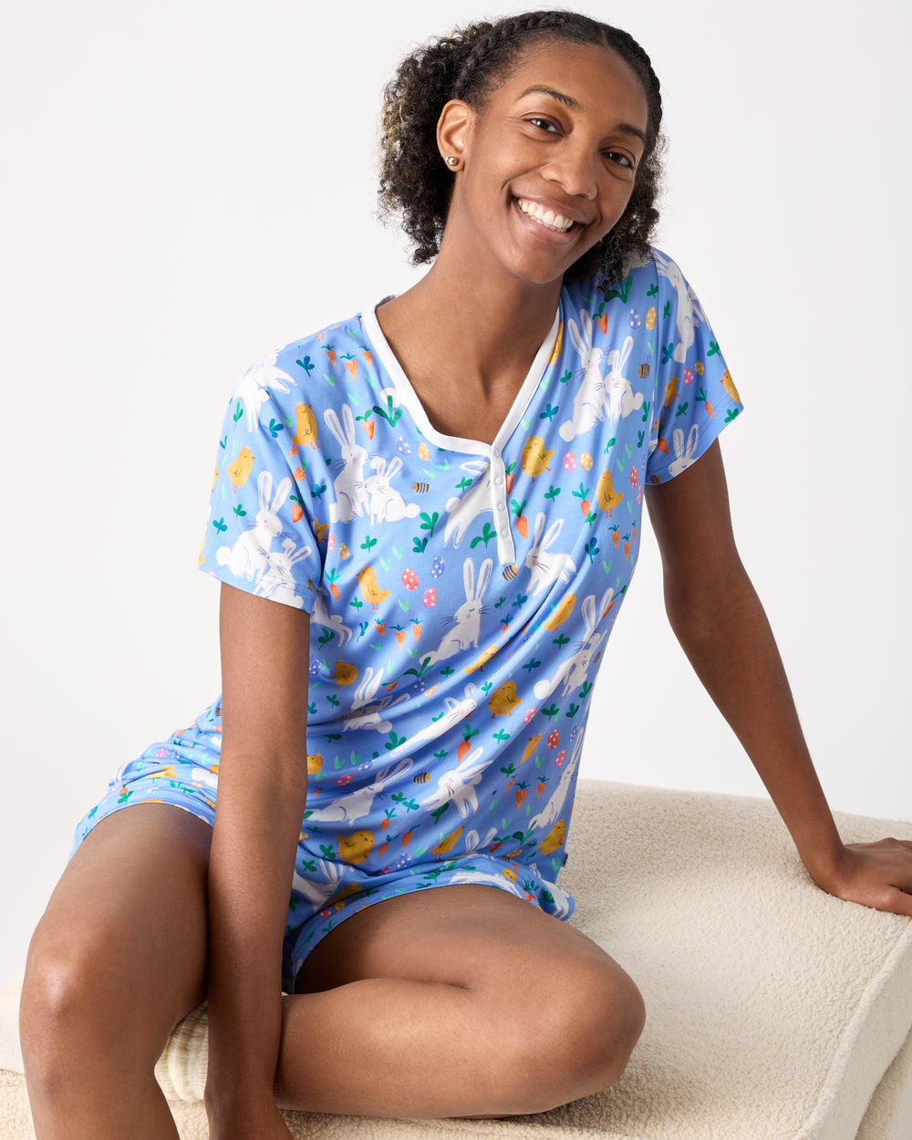Sitting woman wearing the Bunny Patch Women's Short Sleeve Pajama Top