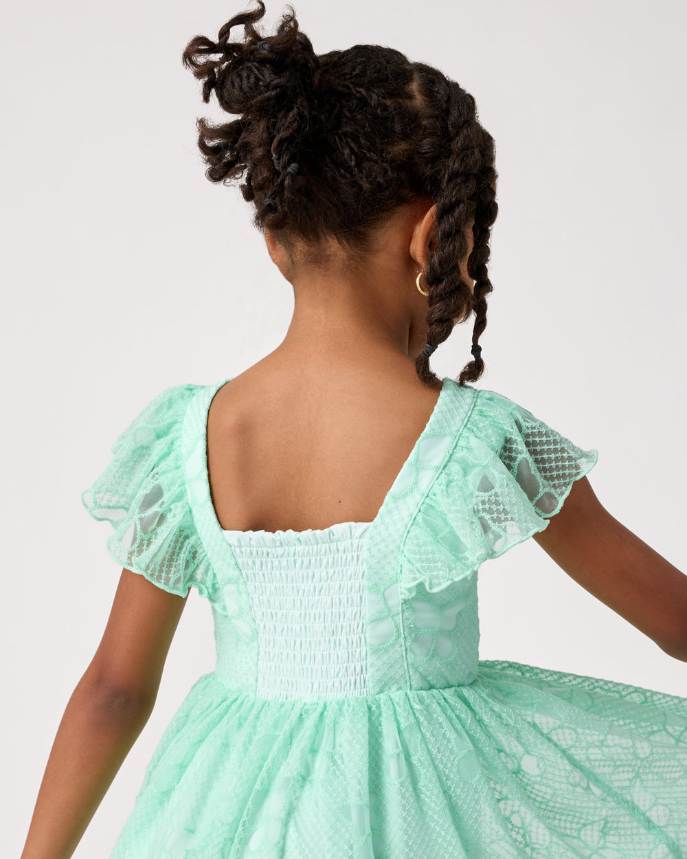 Close up of the smocked detail on the Butterfly Brook Smocked Flutter Dress