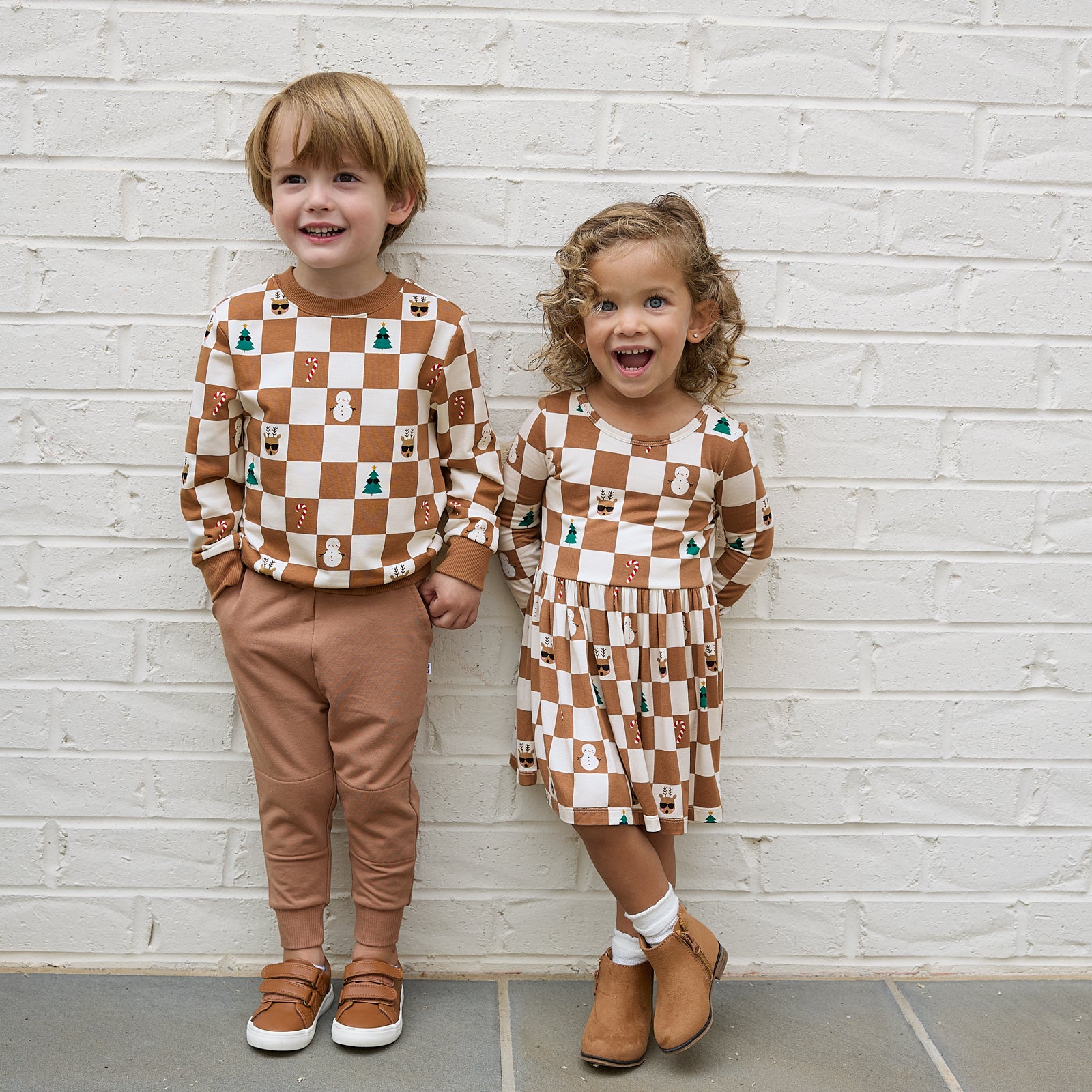 Image of two children wearing matching Holiday Checks Play styles