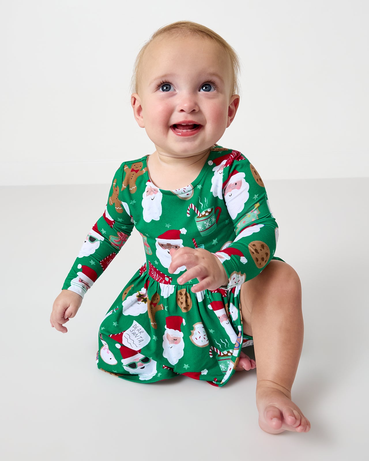 Alternate of sitting baby wearing the Cookies for Santa Bow Back Skater Dress with Bodysuit