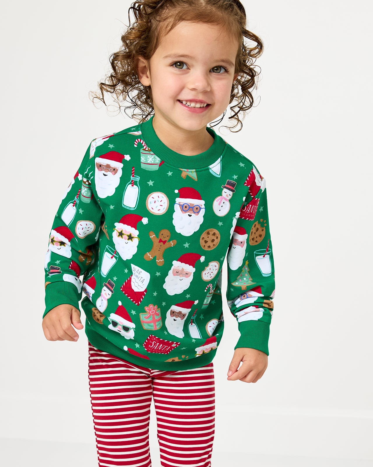 Close up of girl wearing the Cookies for Santa Crewneck Sweatshirt