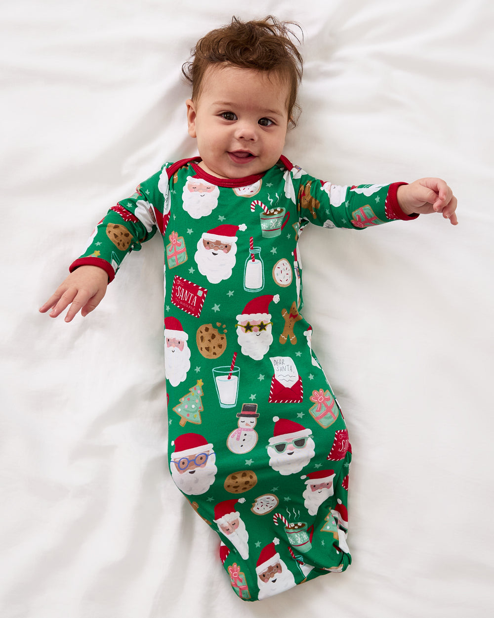 Aerial view of baby wearing the Cookies for Santa Infant Gown