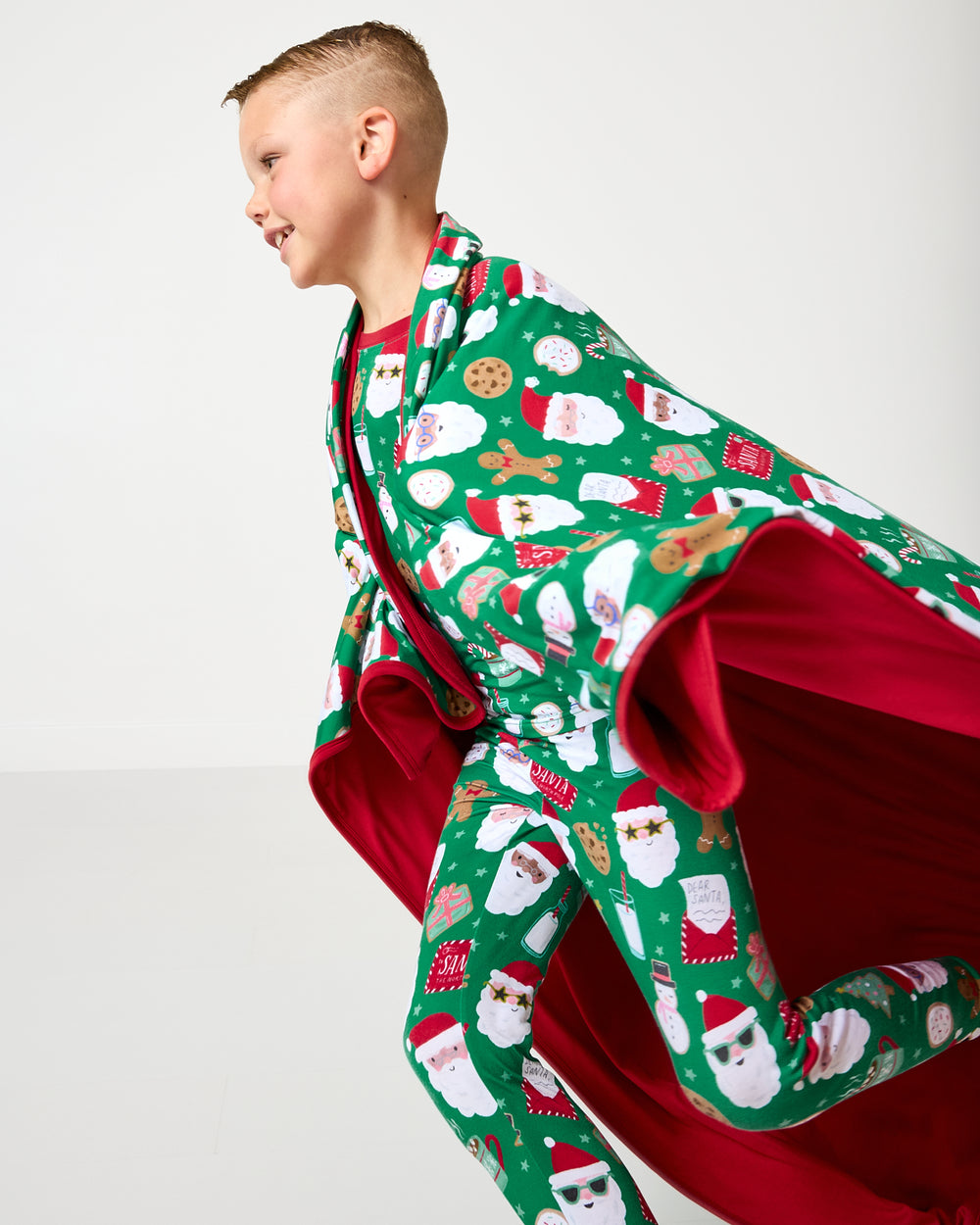 Child in motion wrapped in the Cookies for Santa Large Cloud Blanket®