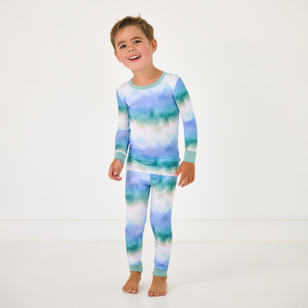 Standing child wearing the Blue Cosmic Mist Two-Piece Pajama Set