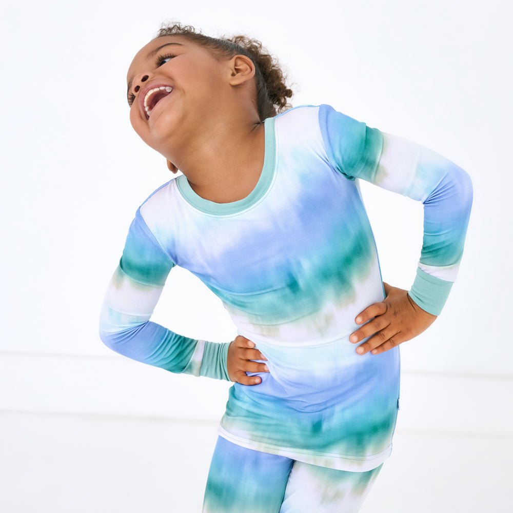 Posing girl wearing the Blue Cosmic Mist Two-Piece Pajama Set
