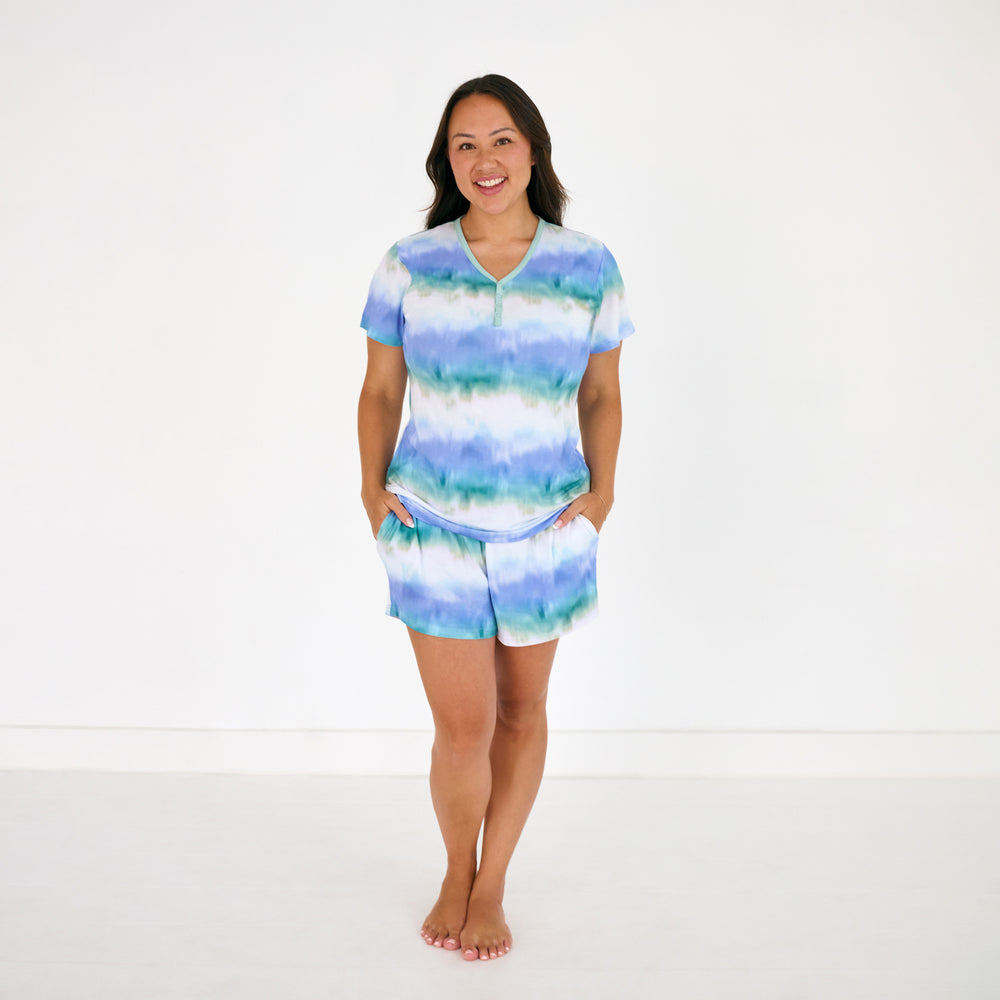 Standing woman wearing the Blue Cosmic Mist Women's Pajama Shorts