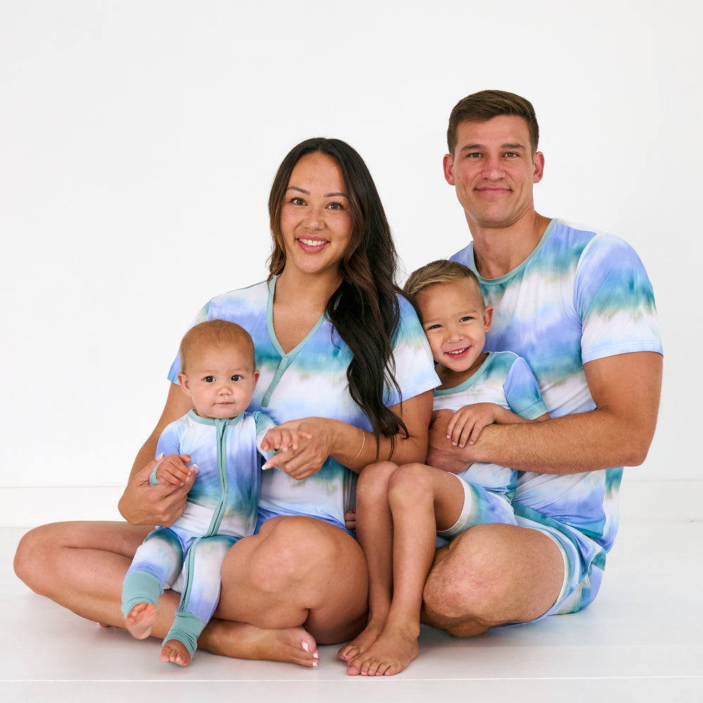 Family of four wearing Blue Cosmic Mist family matching pajamas