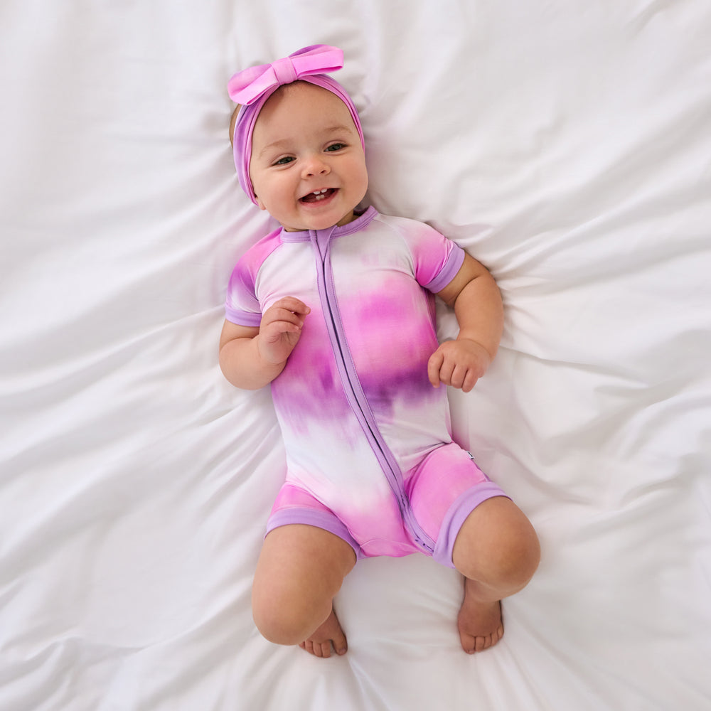 Aerial view of child wearing the Pink Cosmic Mist Shorty Zippy