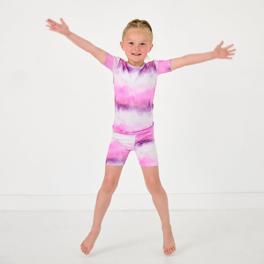Posing girl wearing the Pink Cosmic Mist Two-Piece Short Sleeve & Shorts Pajama Set