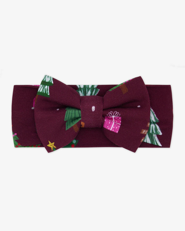 Flat lay of the Cranberry Tree Traffic Luxe Bow Headband