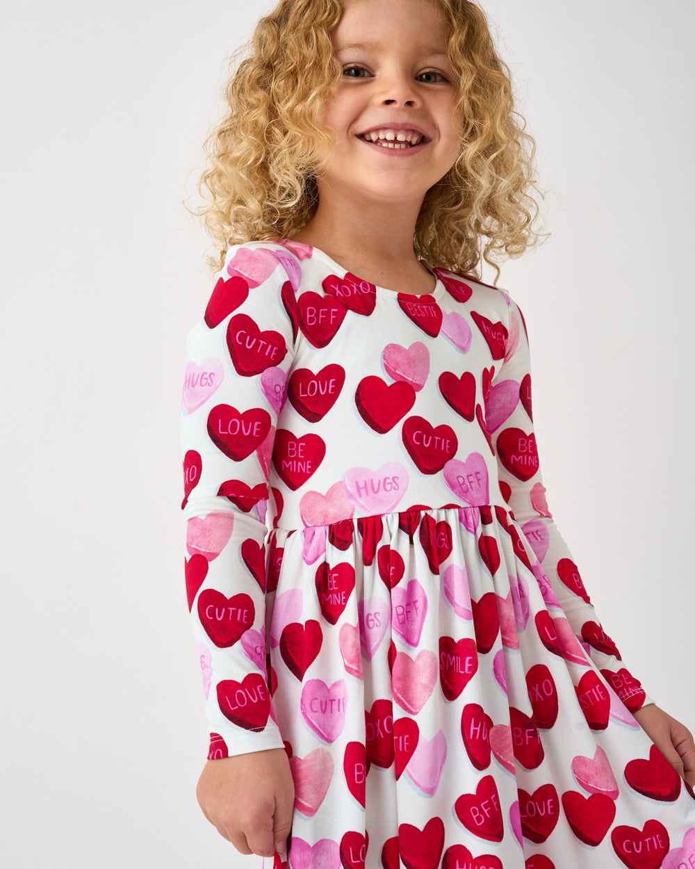 Close up of child wearing the Candy Cuties Bow Back Skater Dress