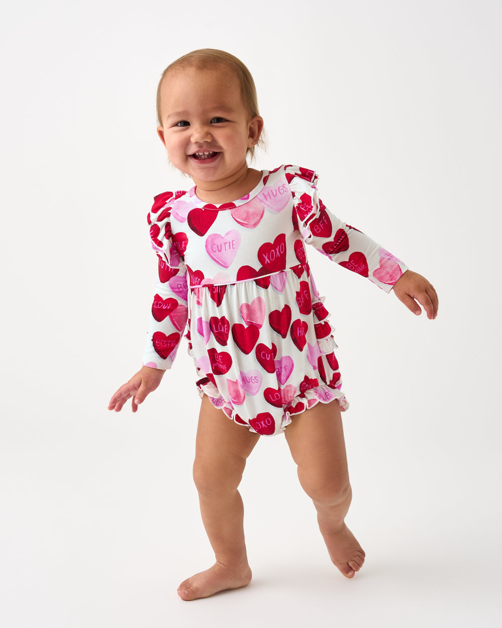 Walking child wearing the Candy Cuties Bubble Romper