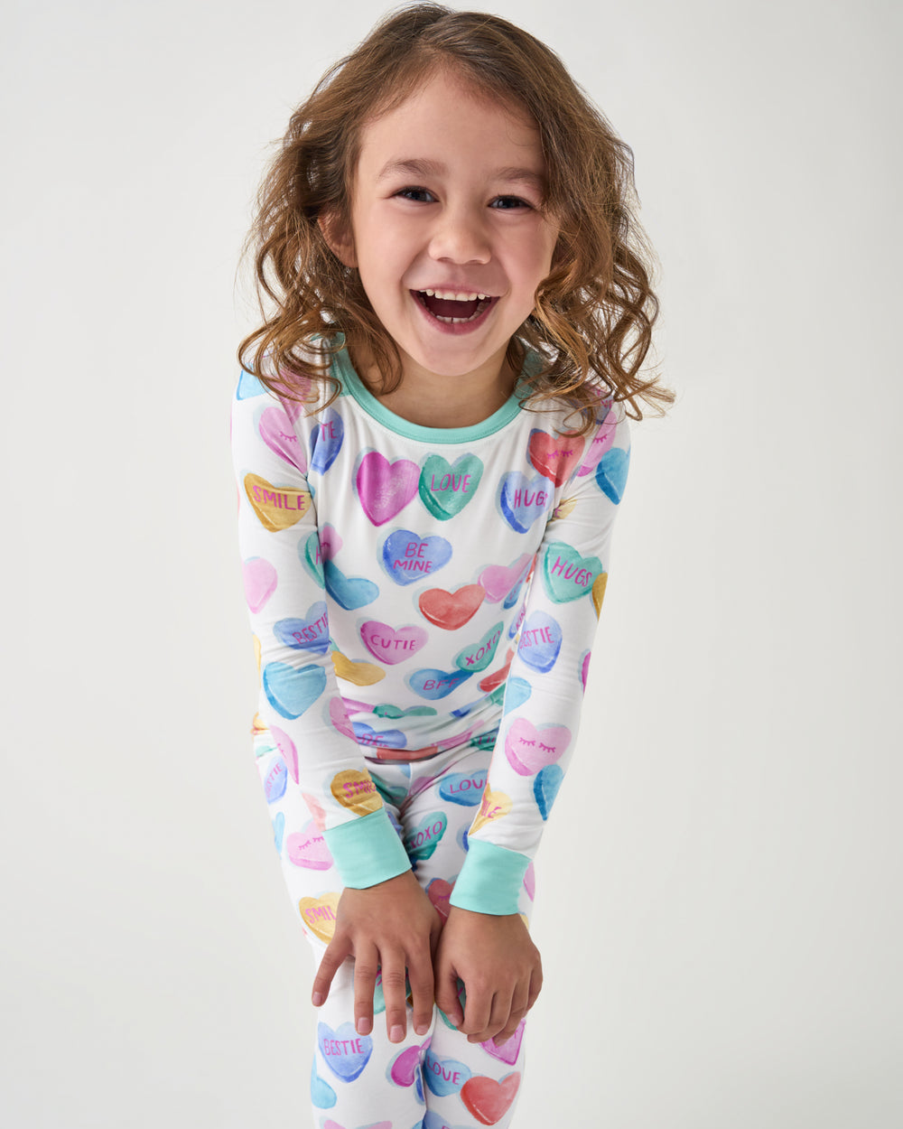 Standing girl wearing the Candy Cuties Two-Piece Pajama Set