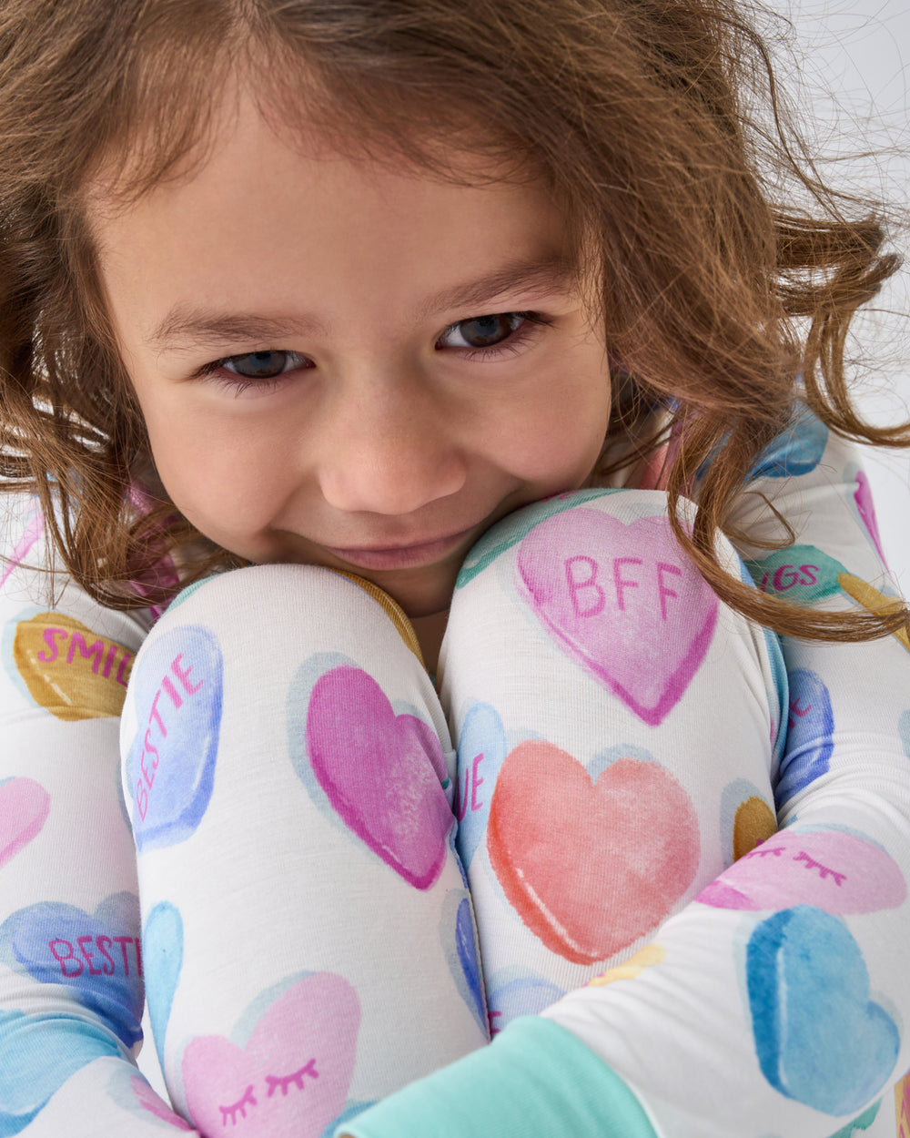 Close up of girl wearing the Candy Cuties Two-Piece Pajama Set