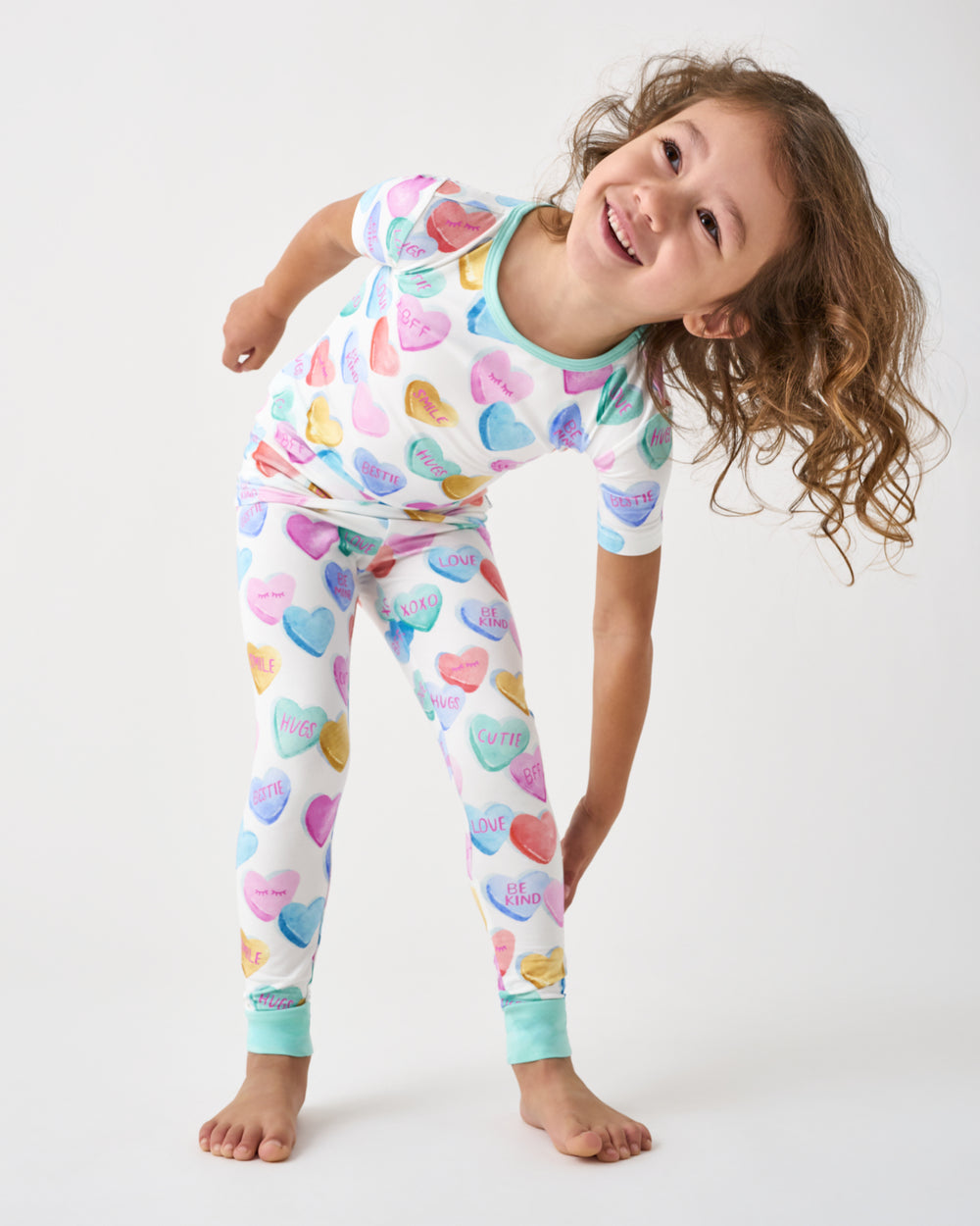 Standing girl wearing the Candy Cuties Two-Piece Short Sleeve Pajama Set