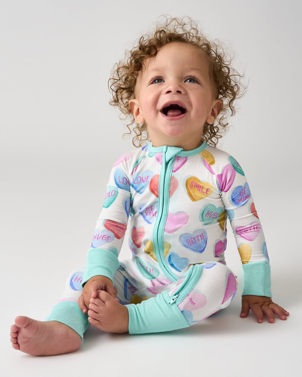 Sitting baby wearing the Candy Cuties Zippy