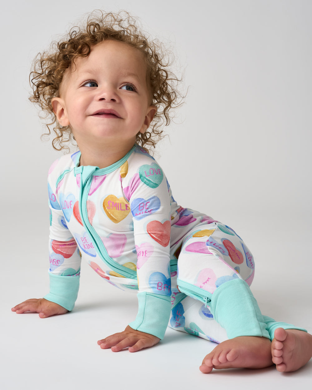 Alternate of sitting baby wearing the Candy Cuties Zippy