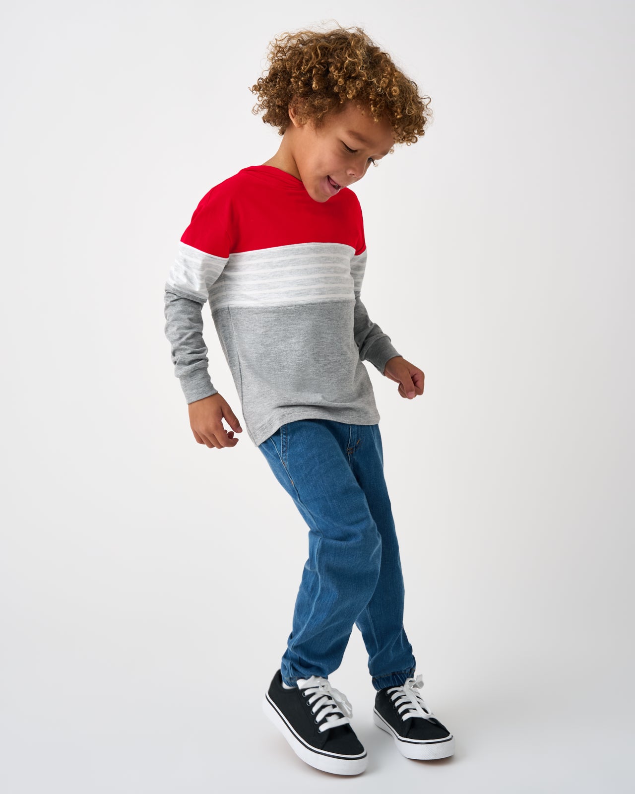 Boy wearing the Candy Red Colorblock Hooded Tee with denim joggers