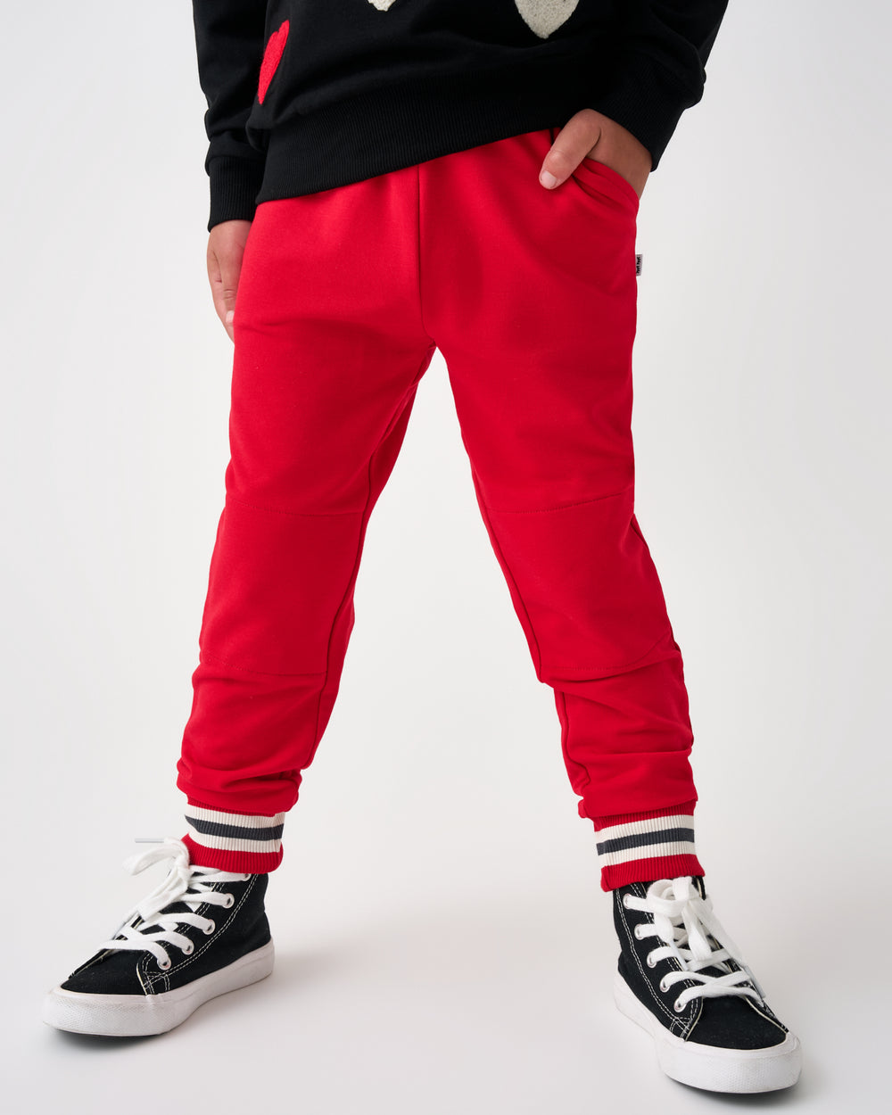 Boy wearing the Candy Red Jogger