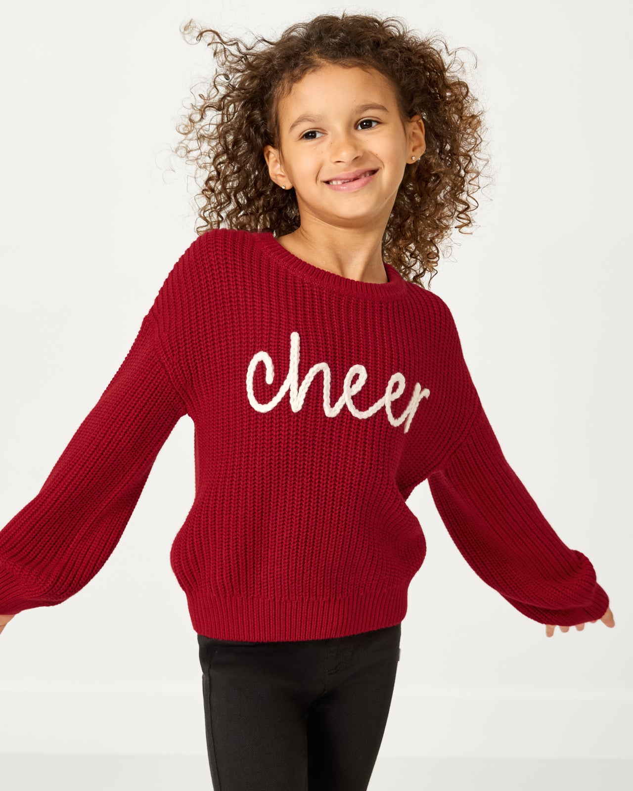Girl wearing the Cheer Drop Shoulder Sweater