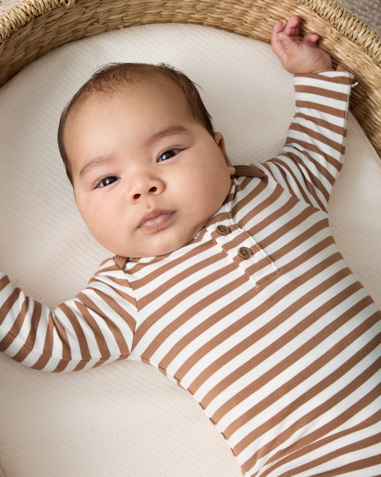 Close up of newborn wearing the Chestnut Brown Stripe Henley Bodysuit