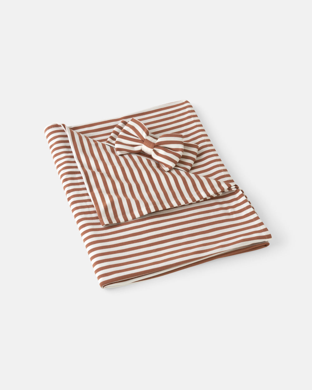 Flat lay of the Chestnut Brown Stripe Swaddle & Luxe Bow Headband Set