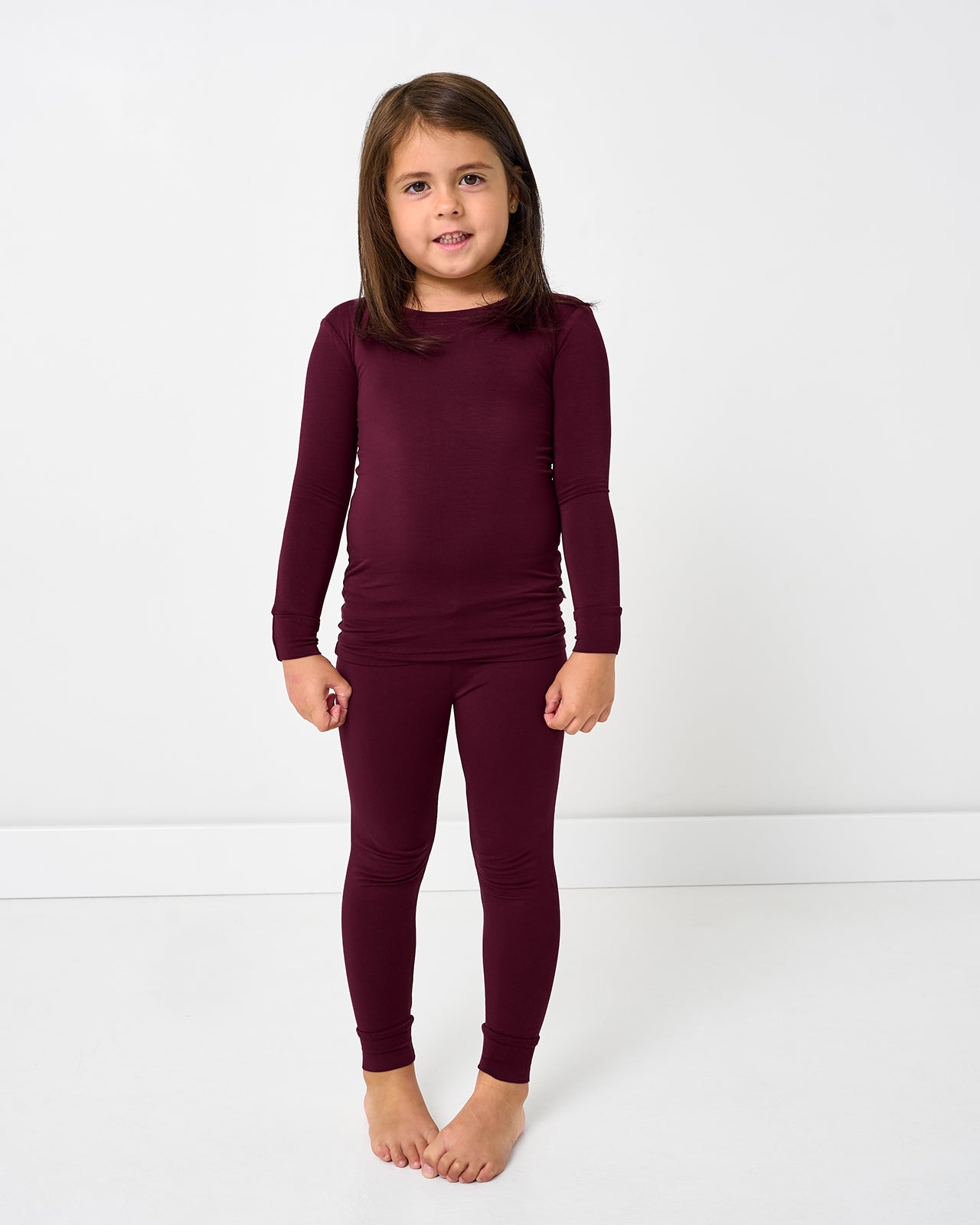 Standing girl wearing the Classic Burgundy Two-Piece Pajama Set