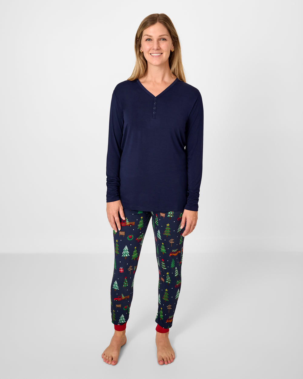 Woman wearing the Classic Navy Women's Long Sleeve Pajama Top with tree traffic pants