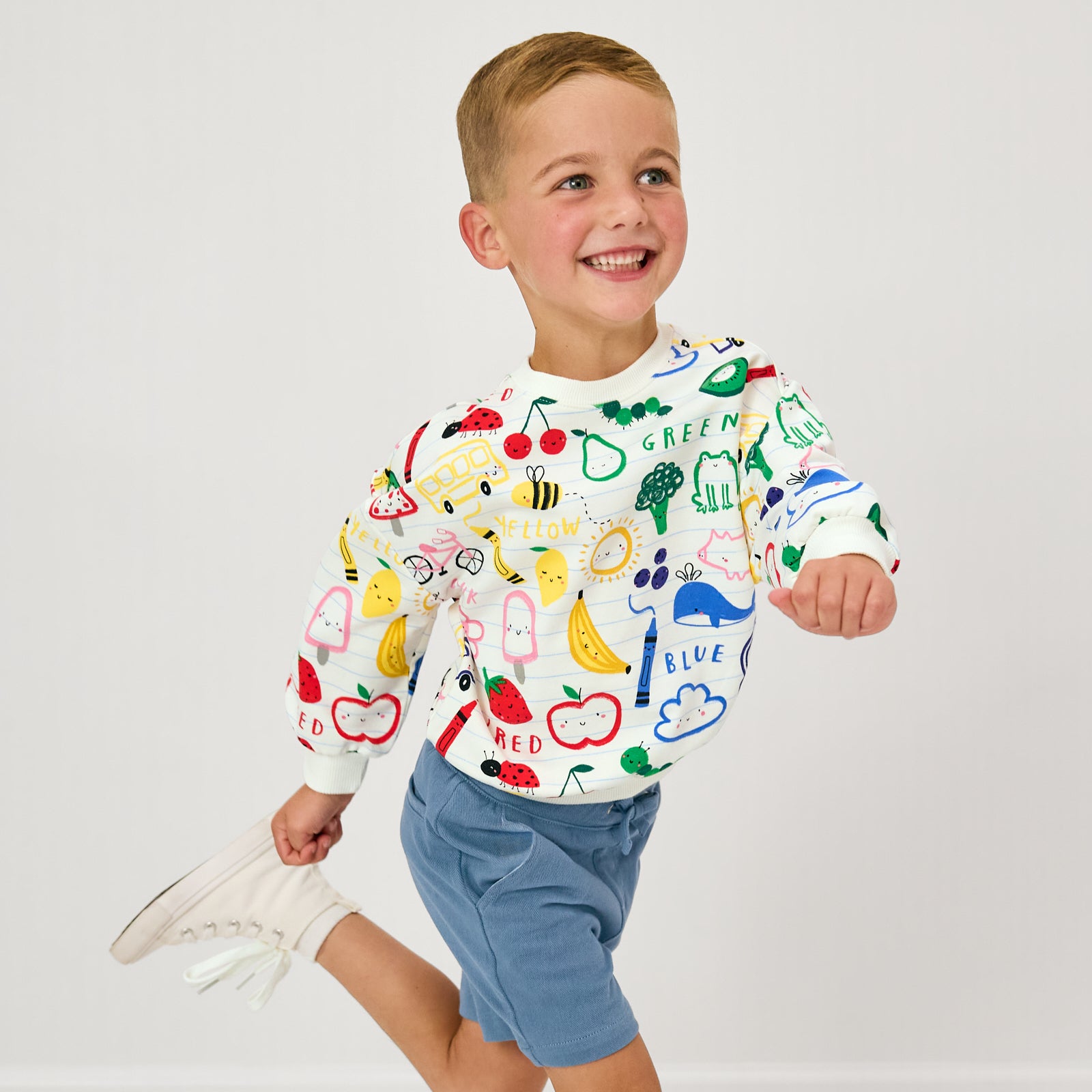 Running child wearing the Coloring Crew Drop Shoulder Crewneck with Steel Blue Chino Shorts