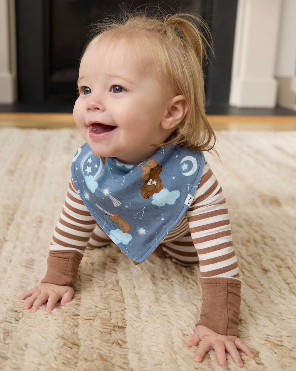 Crawling baby wearing the Constellation Cubs Bandana Bib
