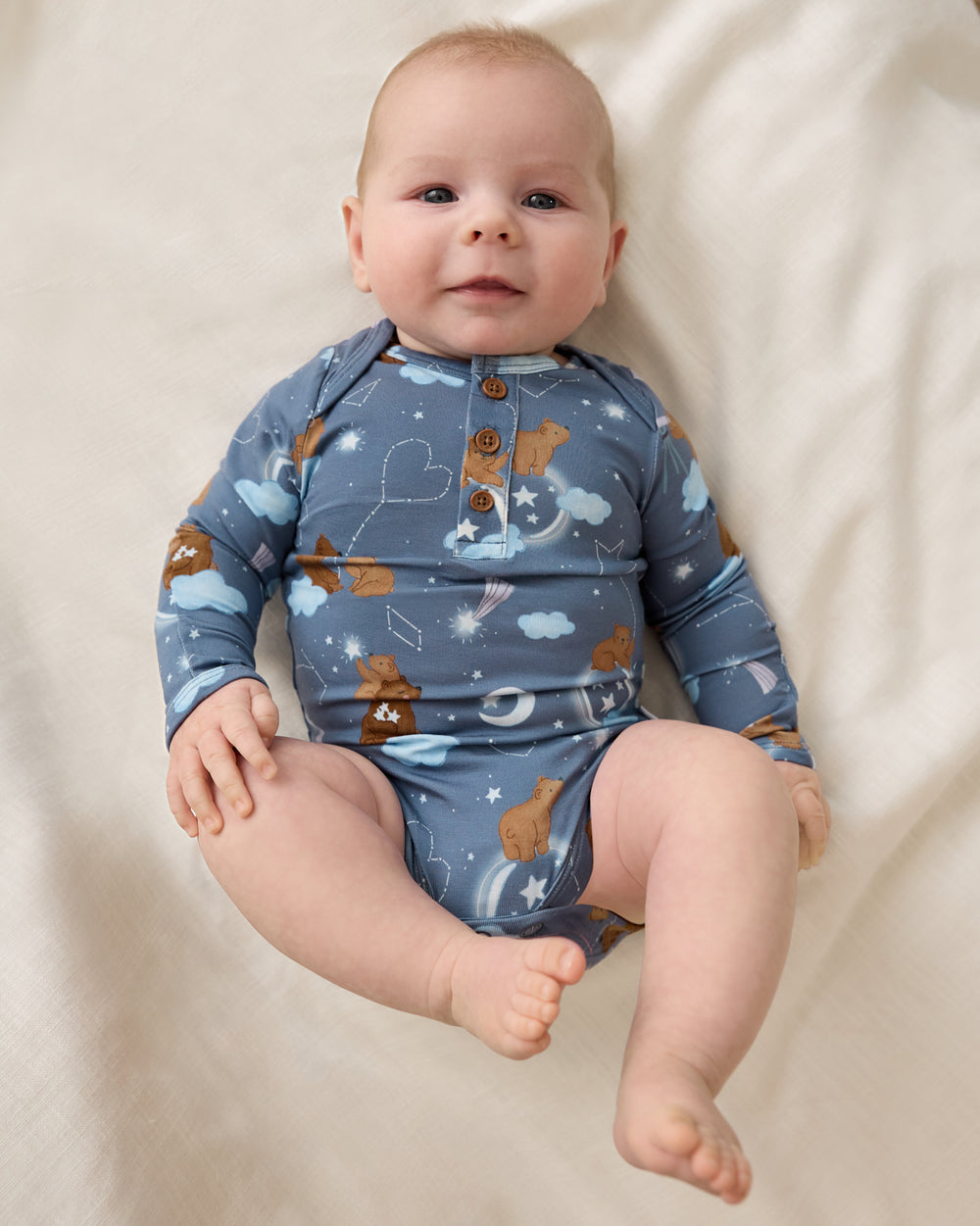 Aerial view of baby wearing the Constellation Cubs Henley Bodysuit