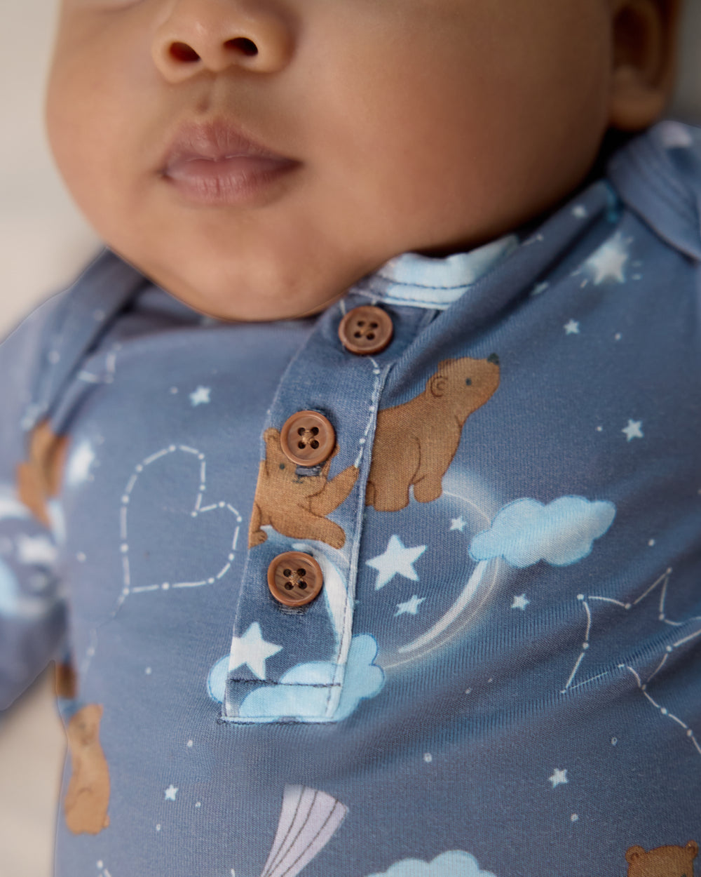 Close up of henley buttons on the Constellation Cubs Henley Bodysuit