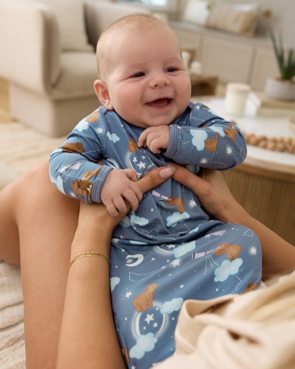 Mother holding baby boy wearing the Constellation Cubs Infant Gown